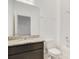 Bathroom featuring a granite countertop, dark wood cabinets, and a tub and shower at 452 Diamond Dove Cv, Winter Springs, FL 32708