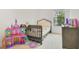 Bright bedroom featuring a bed, window view, carpeted floor and toys in a kid-friendly room at 452 Diamond Dove Cv, Winter Springs, FL 32708