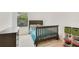 This bedroom features a bed, a dresser, and lots of toys and storage containers at 452 Diamond Dove Cv, Winter Springs, FL 32708