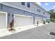 Attached garages showcasing modern doors, fresh landscaping, and well-maintained exteriors, adding curb appeal at 452 Diamond Dove Cv, Winter Springs, FL 32708