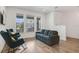 Comfortable living room with modern decor, featuring hardwood floors, plush seating, and ample natural light at 452 Diamond Dove Cv, Winter Springs, FL 32708