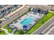 Community pool area with plenty of seating, umbrellas, and a central swimming pool at 452 Diamond Dove Cv, Winter Springs, FL 32708