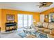 Relaxing living room with large leather couch, piano, sliding glass doors, and decorative table at 4633 Sw 103Rd Pl, Ocala, FL 34476