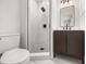 Modern bathroom featuring a stylish vanity and a walk-in shower with decorative tile at 4714 Abaca St, Orlando, FL 32808