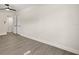 Minimalist bedroom with sleek gray flooring, ceiling fan, and ample natural light at 4714 Abaca St, Orlando, FL 32808