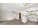 Spacious open-concept kitchen, with white cabinets, stainless steel appliances, and modern lighting at 4714 Abaca St, Orlando, FL 32808