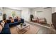 Inviting living room with stylish blue sofa, copper accents, and natural light at 4714 Abaca St, Orlando, FL 32808