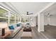 Bright sunroom with modern furniture, ceiling fan, and large windows with natural light at 4714 Abaca St, Orlando, FL 32808