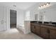 Primary bath boasts a dual sink granite vanity, soaking tub and glass shower at 5204 Obsidian Gate Dr, Mount Dora, FL 32757