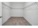 Walk-in closet featuring wire shelving for ample storage and tile flooring at 5204 Obsidian Gate Dr, Mount Dora, FL 32757