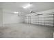 Spacious two-car garage with bright lights and automatic door openers at 5204 Obsidian Gate Dr, Mount Dora, FL 32757