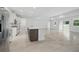 Open kitchen featuring a large island, and white cabinets at 5204 Obsidian Gate Dr, Mount Dora, FL 32757