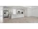 Spacious open-concept kitchen and living area with tile floors and recessed lighting at 5204 Obsidian Gate Dr, Mount Dora, FL 32757