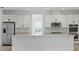 Bright kitchen featuring granite countertops, and stainless steel appliances at 5204 Obsidian Gate Dr, Mount Dora, FL 32757