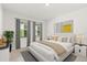 Modern bedroom with stylish window treatments, a cozy rug, and minimalist decor at 5226 Mahogany Dr, Mount Dora, FL 32757