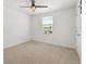 Bedroom with carpet flooring, fan and window at 5226 Mahogany Dr, Mount Dora, FL 32757