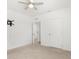 Simple bedroom featuring a fan, a closet, and neutral paint at 5226 Mahogany Dr, Mount Dora, FL 32757