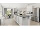 Spacious kitchen with granite countertops, stainless steel appliances, and an open layout at 5226 Mahogany Dr, Mount Dora, FL 32757
