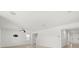 Bright open concept living room features modern ceiling fan and a view of the kitchen at 5226 Mahogany Dr, Mount Dora, FL 32757