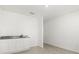 Bright wet bar area features white cabinetry, granite countertops, and tile flooring at 5226 Mahogany Dr, Mount Dora, FL 32757