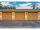 View of the complex garage and parking area at 5263 Images Cir # 306, Kissimmee, FL 34746