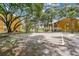 Community sand volleyball court surrounded by lush trees at 5263 Images Cir # 306, Kissimmee, FL 34746