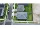 Aerial shot of backyard with manicured lawns and neighborhood streets showcasing homes in the community at 5310 Teirgarten St, St Cloud, FL 34771