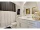 Stylish bathroom boasts a vanity with a large mirror and decorative accents, creating a serene space at 5310 Teirgarten St, St Cloud, FL 34771