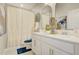 Bright bathroom featuring a double vanity with modern fixtures, complemented by a neutral color palette at 5310 Teirgarten St, St Cloud, FL 34771