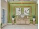 Grand foyer featuring a modern console table, decorative wall art, and a bright, inviting space at 5310 Teirgarten St, St Cloud, FL 34771