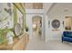 Elegant foyer with soaring ceilings, decorative wall art, and neutral flooring creating a welcoming ambiance at 5310 Teirgarten St, St Cloud, FL 34771