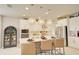 Modern kitchen with white cabinetry, stainless steel appliances, a large island, and pendant lighting at 5310 Teirgarten St, St Cloud, FL 34771