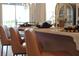 Kitchen island featuring white countertop, stylish bar stools, and decorative place settings at 5310 Teirgarten St, St Cloud, FL 34771