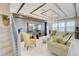 Inviting living room with decorative ceiling, hardwood floors, stylish furnishings, and bright natural light at 5310 Teirgarten St, St Cloud, FL 34771