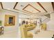 Open-concept living area with decorative ceiling, modern decor, hardwood floors, and ample natural light at 5310 Teirgarten St, St Cloud, FL 34771