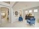 Cozy living room featuring elegant decor, neutral walls, and archways creating a warm, inviting space at 5310 Teirgarten St, St Cloud, FL 34771