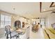 Open floor plan featuring a dining area that flows into a kitchen with an island and bar seating at 5310 Teirgarten St, St Cloud, FL 34771