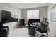 Well-lit office space with modern furnishings, including a large window providing natural light for productivity at 5310 Teirgarten St, St Cloud, FL 34771