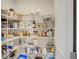 Organized walk-in pantry with wire shelving providing ample storage for food and household items at 5310 Teirgarten St, St Cloud, FL 34771