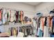 Spacious walk-in closet features extensive shelving and ample storage for organizing wardrobes and accessories at 5310 Teirgarten St, St Cloud, FL 34771