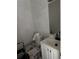 Cozy bathroom featuring a white vanity, toilet, and a framed mirror at 6308 Stanwin Dr, Apopka, FL 32712
