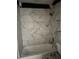 Bathroom featuring tiled shower, tub, toilet, and hardware at 6308 Stanwin Dr, Apopka, FL 32712