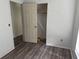 A charming bedroom featuring wood flooring, closet, and a welcoming ambiance at 6308 Stanwin Dr, Apopka, FL 32712