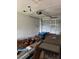 A well-lit garage featuring an automatic door opener, tools, and space for vehicle parking at 6308 Stanwin Dr, Apopka, FL 32712