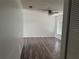 Spacious living room featuring a ceiling fan and wood-style flooring at 6308 Stanwin Dr, Apopka, FL 32712