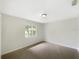 Bright and airy bedroom with a window and neutral color scheme at 6740 Odoniel W Loop, Lakeland, FL 33809