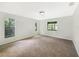 Bright bedroom with neutral walls, carpet, and windows offering natural light at 6740 Odoniel W Loop, Lakeland, FL 33809