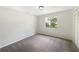 Bedroom featuring neutral paint, carpet flooring, and a window for natural light at 6740 Odoniel W Loop, Lakeland, FL 33809