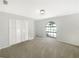 Well-lit bedroom with carpet floors, natural light, and a double door closet at 6740 Odoniel W Loop, Lakeland, FL 33809