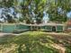 Well-maintained home with manicured lawn and arched windows at 6740 Odoniel W Loop, Lakeland, FL 33809